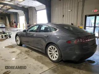 2017 Tesla Model S 100D with VIN 5YJSA1E29HF210731, listed as a Copart auction lot 56762565 with 114,117 mi miles and Salvage title. Bid and sale history available at DreamBid. Image 2.
