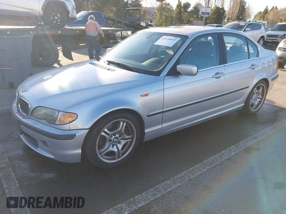 2003 BMW 3 Series 330i with VIN WBAEV53463KM29698, listed as a IAAI auction lot 41528947 with 204,400 mi miles. Bid and sale history available at carsss.com. Image 2.