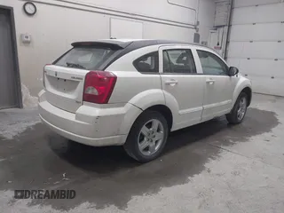 2009 Dodge Caliber SXT with VIN 1B3HB48A19D212690, listed as a IAAI auction lot 42076527 with 212,909 mi miles and . Bid and sale history available at carsss.com. Image 4.