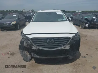 2021 Mazda CX-9 Touring with VIN JM3TCACY9M0526376, listed as a IAAI auction lot 42264478 with 74,671 mi miles and . Bid and sale history available at DreamBid. Image 12.
