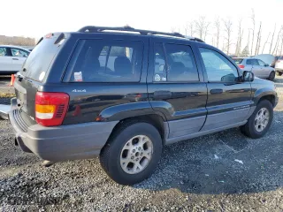 1999 Jeep Grand Cherokee Laredo with VIN 1J4GW58N1XC737706, listed as a Copart auction lot 83107914 with 0 mi miles and Salvage Title. Bid and sale history available at carsss.com. Image 3.