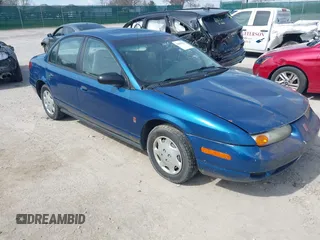 2002 Saturn SL z VIN 1G8ZG52822Z132267, wystawiony jako IAAI lot #41906634 z przebiegiem 144 001 mil mil oraz . Historia ofert i sprzedaży dostępna na DreamBid. Obrazek 1.