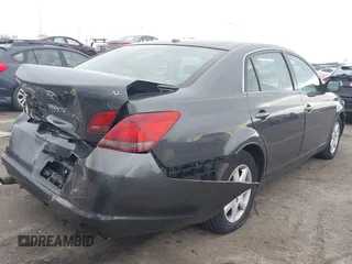 2009 Toyota Avalon XL with VIN 4T1BK36B59U350786, listed as a IAAI auction lot 41322151 with 222,128 mi miles and . Bid and sale history available at carsss.com. Image 4.