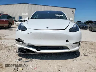 2023 Tesla Model Y Long Range z VIN 7SAYGDEE1PA155629, wystawiony jako Copart lot #52234735 z przebiegiem 24 944 mil mil oraz Szkoda całkowita • Salvage title. Historia ofert i sprzedaży dostępna na DreamBid. Obrazek 5.