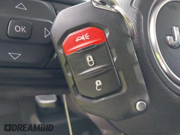 2023 Jeep Wrangler Sport with VIN 1C4HJXDG2PW508235, listed as a IAAI auction lot 42127823 with 25,069 mi miles and . Bid and sale history available at DreamBid. Image 11.