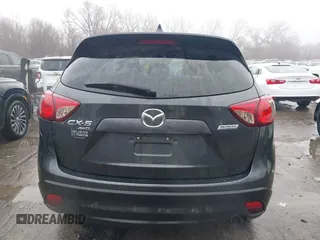 2014 Mazda CX-5 Grand Touring with VIN JM3KE4DY0E0392476, listed as a IAAI auction lot 41419144 with 89,245 mi miles and . Bid and sale history available at carsss.com. Image 16.