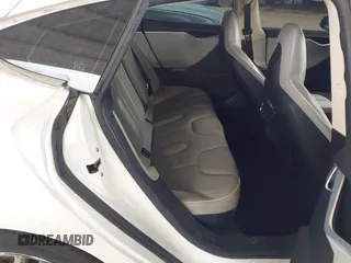 2013 Tesla Model S с VIN 5YJSA1CG8DFP22036, выставлен на аукционе IAAI как лот 41886249 с пробегом 125 477 миль миль и . История ставок и продаж доступна на DreamBid. Изображение 8.
