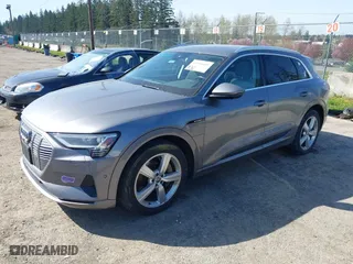 2019 Audi e-tron Premium Plus with VIN WA1LAAGE4KB012574, listed as a IAAI auction lot 41916641 with 104,911 mi miles. Bid and sale history available at carsss.com. Image 2.