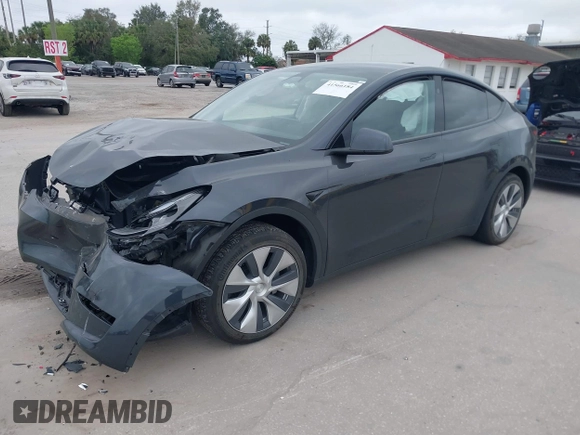 2024 Tesla Model Y with VIN 7SAYGDED3RF002246, listed as a IAAI auction lot 41566184 with 10,316 mi miles and . Bid and sale history available at DreamBid. Image 16.