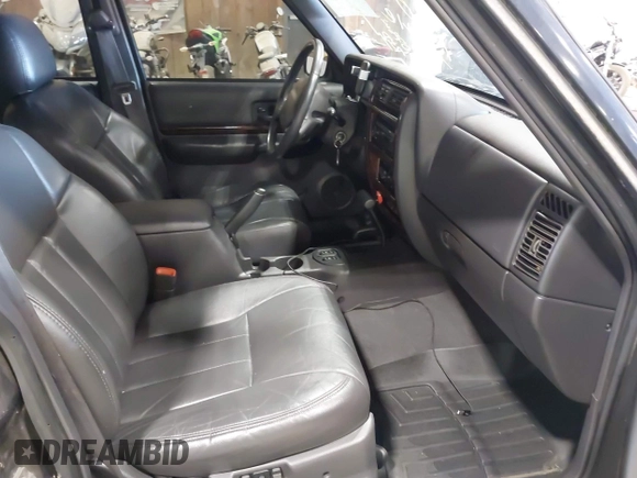 2001 Jeep Cherokee Sport z VIN 1J4FF58S11L562933, wystawiony jako IAAI lot #41944672 z przebiegiem 163 078 mil mil oraz . Historia ofert i sprzedaży dostępna na DreamBid. Obrazek 5.