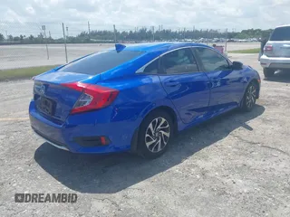 2018 Honda Civic EX with VIN 19XFC2F72JE036055, listed as a IAAI auction lot 41960037 with 128,650 mi miles and . Bid and sale history available at DreamBid. Image 4.