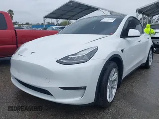 2021 Tesla Model Y Long Range with VIN 5YJYGAEE2MF260142, listed as a IAAI auction lot 41808666 with 87,316 mi miles and . Bid and sale history available at DreamBid. Image 2.