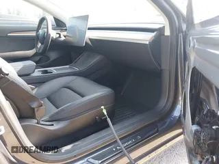 2023 Tesla Model 3 z VIN 5YJ3E1EA5PF656325, wystawiony jako IAAI lot #42465795 z przebiegiem 30 256 mil mil oraz . Historia ofert i sprzedaży dostępna na DreamBid. Obrazek 5.