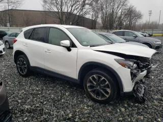 2016 Mazda CX-5 Grand Touring with VIN JM3KE4DY8G0728765, listed as a Copart auction lot 51625825 with 141,681 mi miles and Salvage Title. Bid and sale history available at carsss.com. Image 4.