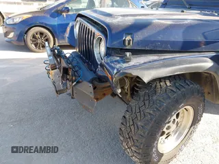 1997 Jeep Wrangler Sport with VIN 1J4FY19S1VP462136, listed as a IAAI auction lot 41766868 with 130,980 mi miles. Bid and sale history available at carsss.com. Image 6.
