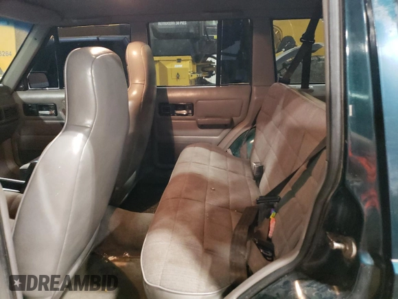 1996 Jeep Cherokee Sport with VIN 1J4FJ68S1TL226495, listed as a Copart auction lot 58587685 with 205,397 mi miles and Salvage title. Bid and sale history available at DreamBid. Image 11.