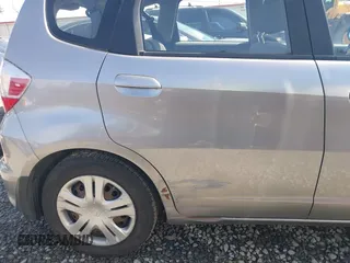 2010 Honda Fit with VIN JHMGE8H20AC010062, listed as a IAAI auction lot 41964011 with 104,651 mi miles. Bid and sale history available at carsss.com. Image 6.