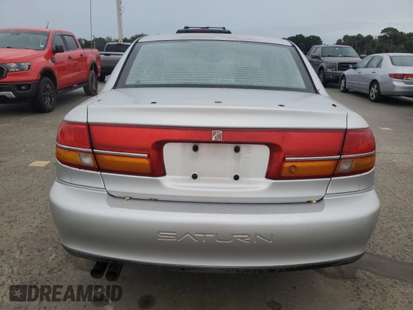 2002 Saturn LS z VIN 1G8JW54R32Y517171, wystawiony jako Copart lot #74849884 z przebiegiem Nie podano mil oraz Szkody całkowita. Historia ofert i sprzedaży dostępna na DreamBid. Obrazek 6.