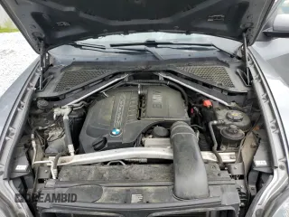 2012 BMW X5 35i with VIN 5UXZV4C50CL991452, listed as a Copart auction lot 56890265 with 147,019 mi miles and Salvage title. Bid and sale history available at DreamBid. Image 12.