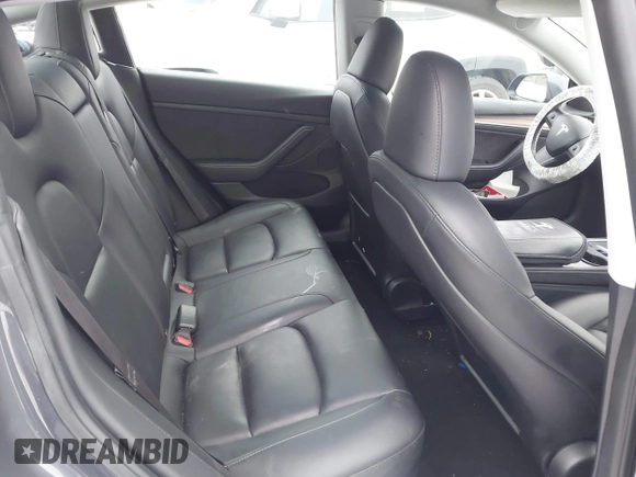 2023 Tesla Model 3 Long Range with VIN 5YJ3E1EBXPF708122, listed as a IAAI auction lot 41185314 with 27,765 mi miles and . Bid and sale history available at DreamBid. Image 8.
