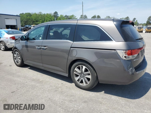2014 Honda Odyssey Touring with VIN 5FNRL5H93EB061754, listed as a Copart auction lot 55182015 with 168,058 mi miles and Salvage title. Bid and sale history available at DreamBid. Image 2.
