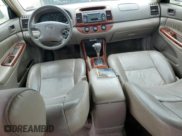 2004 Toyota Camry LE z VIN JTDBE32K440281087, wystawiony jako Copart lot #60486995 z przebiegiem 229 856 mil mil oraz Czysty tytuł • Clean title. Historia ofert i sprzedaży dostępna na DreamBid. Obrazek 9.