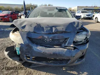 2010 Toyota Corolla with VIN 2T1BU4EE1AC363990, listed as a Copart auction lot 52001595 with 244,000 mi miles and Salvage title. Bid and sale history available at DreamBid. Image 5.