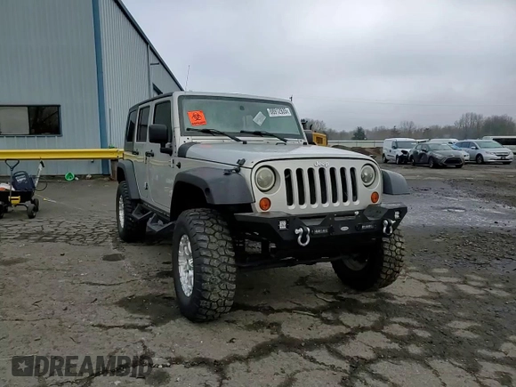 2007 Jeep Wrangler Unlimited X with VIN 1J4GA39177L105582, listed as a Copart auction lot 88912935 with 156,156 mi miles and Salvage Title. Bid and sale history available at DreamBid. Image 12.