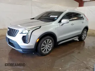 2022 Cadillac XT4 FWD Premium Luxury z VIN 1GYFZCR47NF100232, wystawiony jako Copart lot #54520405 z przebiegiem 68 819 mil mil oraz Czysty tytuł • Clean title. Historia ofert i sprzedaży dostępna na DreamBid. Obrazek 1.