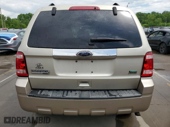 2010 Ford Escape Limited z VIN 1FMCU9EG2AKB77985, wystawiony jako Copart lot #56747655 z przebiegiem 88 362 mil mil oraz Szkoda całkowita • Salvage title. Historia ofert i sprzedaży dostępna na DreamBid. Obrazek 6.