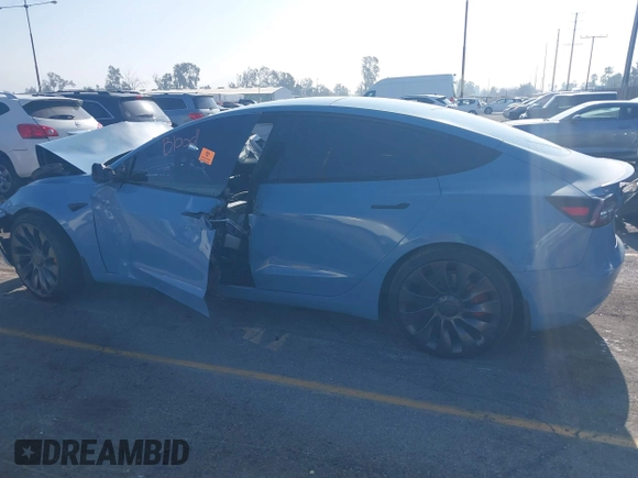 2022 Tesla Model 3 Performance with VIN 5YJ3E1EC1NF144236, listed as a IAAI auction lot 41189644 with Not Provided miles. Bid and sale history available at carsss.com. Image 14.