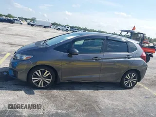 2015 Honda Fit EX-L z VIN 3HGGK5H89FM730013, wystawiony jako IAAI lot #42673309 z przebiegiem 142 660 mil mil oraz . Historia ofert i sprzedaży dostępna na DreamBid. Obrazek 14.