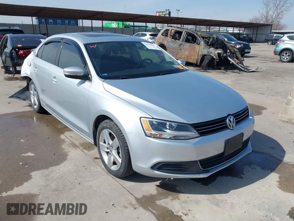 2014 Volkswagen Jetta TDI w/Premium with VIN 3VWLL7AJ6EM424935, listed as a IAAI auction lot 41533634 with 64,028 mi miles and . Bid and sale history available at DreamBid. Image 1.