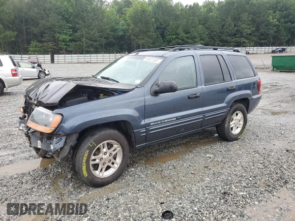 2004 Jeep Grand Cherokee Laredo with VIN 1J4GX48SX4C201569, listed as a Copart auction lot 58631585 with 271,124 mi miles and Salvage title. Bid and sale history available at DreamBid. Image 1.