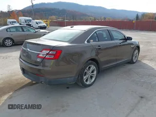 2015 Ford Taurus SEL with VIN 1FAHP2H87FG199865, listed as a IAAI auction lot 40760225 with 77,782 mi miles. Bid and sale history available at carsss.com. Image 4.