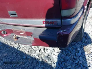 2001 GMC Jimmy SL with VIN 1GKCS13W012143344, listed as a IAAI auction lot 41385552 with 216,127 mi miles. Bid and sale history available at carsss.com. Image 12.