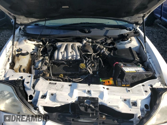 2000 Mercury Sable z VIN 1MEFM53U7YG640279, wystawiony jako Copart lot #70701264 z przebiegiem 118 790 mil mil oraz Szkoda całkowita • Salvage title. Historia ofert i sprzedaży dostępna na DreamBid. Obrazek 11.