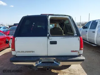 1998 GMC Suburban with VIN 1GKEC16RXWJ731468, listed as a IAAI auction lot 41945613 with 236,854 mi miles. Bid and sale history available at carsss.com. Image 16.