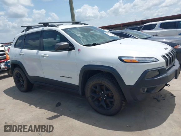 2014 Jeep Cherokee Trailhawk with VIN 1C4PJMBS5EW231448, listed as a IAAI auction lot 42632143 with 97,461 mi miles and . Bid and sale history available at DreamBid. Image 1.