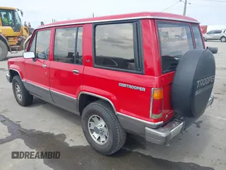 1991 Isuzu Trooper z VIN JACCH58R0M7904092, wystawiony jako IAAI lot #41900283 z przebiegiem 226 780 mil mil oraz . Historia ofert i sprzedaży dostępna na DreamBid. Obrazek 3.