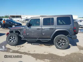 2020 Jeep Wrangler Unlimited Rubicon z VIN 1C4HJXFN0LW300344, wystawiony jako IAAI lot #41943662 z przebiegiem 59 051 mil mil oraz . Historia ofert i sprzedaży dostępna na DreamBid. Obrazek 14.