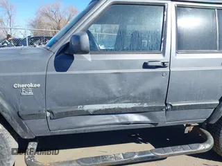 1997 Jeep Cherokee Sport with VIN 1J4FJ68S4VL567490, listed as a IAAI auction lot 41659872 with 404,766 mi miles. Bid and sale history available at carsss.com. Image 6.