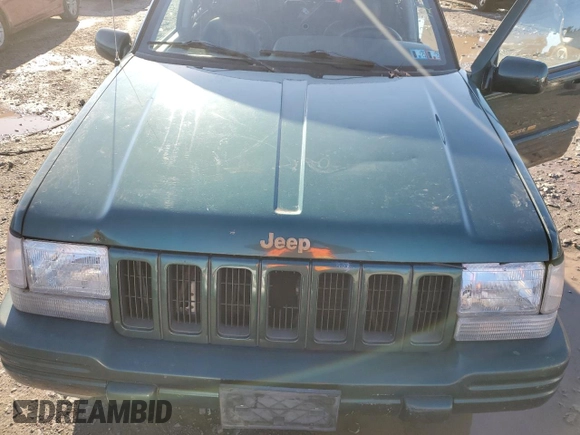 1997 Jeep Grand Cherokee Limited with VIN 1J4GZ78Y2VC728605, listed as a Copart auction lot 83342804 with 104,185 mi miles and Salvage Title. Bid and sale history available at carsss.com. Image 13.