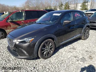 2016 Mazda CX-3 Grand Touring with VIN JM1DKBD7XG0107274, listed as a Copart auction lot 52137385 with 35,376 mi miles and Salvage Title. Bid and sale history available at carsss.com. Image 1.