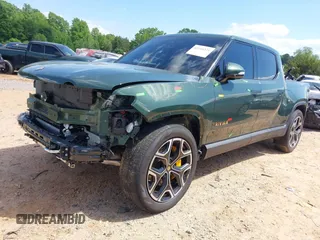 2023 Rivian R1T Adventure z VIN 7FCTGAAAXPN019894, wystawiony jako IAAI lot #42168226 z przebiegiem 23 380 mil mil oraz . Historia ofert i sprzedaży dostępna na DreamBid. Obrazek 2.