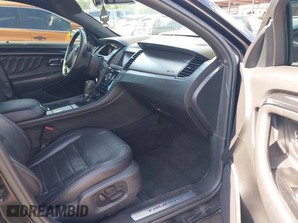 2013 Ford Taurus SHO z VIN 1FAHP2KT1DG135962, wystawiony jako IAAI lot #42449604 z przebiegiem 138 921 mil mil oraz . Historia ofert i sprzedaży dostępna na DreamBid. Obrazek 5.