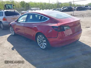 2018 Tesla Model 3 Long Range Battery z VIN 5YJ3E1EA3JF047287, wystawiony jako IAAI lot #42099771 z przebiegiem 120 470 mil mil oraz . Historia ofert i sprzedaży dostępna na DreamBid. Obrazek 3.