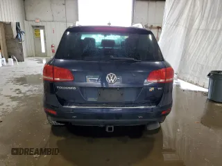 2014 Volkswagen Touareg Sport с VIN WVGEF9BP2ED002718, выставлен на аукционе Copart как лот 59526575 с пробегом 194 480 миль миль и На запчасти • Non repairable. История ставок и продаж доступна на DreamBid. Изображение 6.
