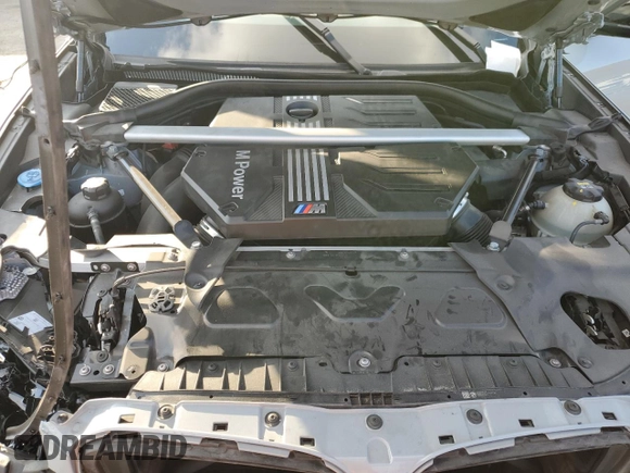 2022 BMW X4 M z VIN 5YM23EC00N9L35827, wystawiony jako Copart lot #87932635 z przebiegiem Nie podano mil oraz Szkoda całkowita • Salvage title. Historia ofert i sprzedaży dostępna na DreamBid. Obrazek 13.