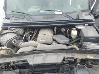 2004 Hummer H2 z VIN 5GRGN23U74H100175, wystawiony jako Copart lot #52642125 z przebiegiem 112 305 mil mil oraz Szkoda całkowita • Salvage title. Historia ofert i sprzedaży dostępna na DreamBid. Obrazek 13.